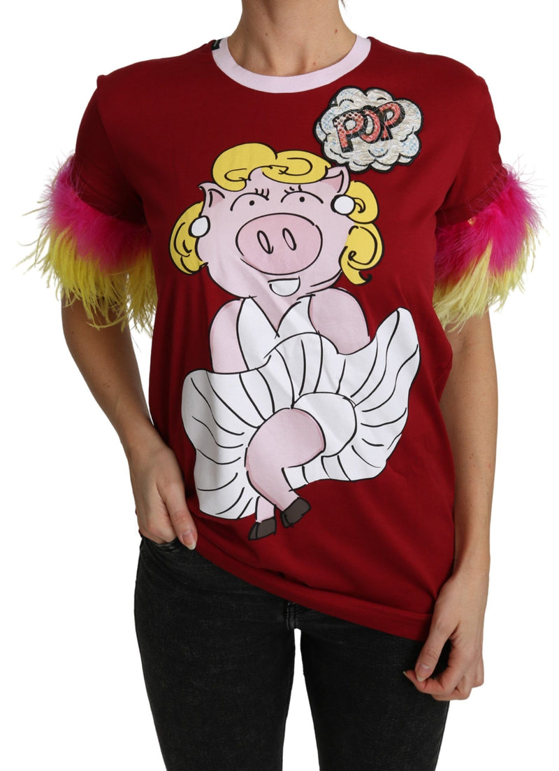 Red cotton t-shirt featuring a cartoon pig graphic and vibrant pink and yellow feather trimmed short sleeves