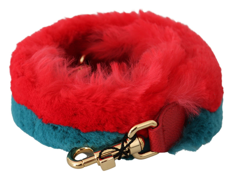 Red and blue rabbit fur shoulder strap with gold hardware coiled up