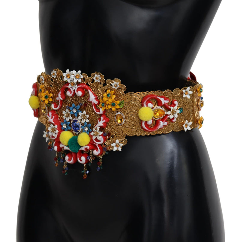 Ornate gold filigree wide waist belt with colorful floral crystals, red enamel details, and yellow pom poms
