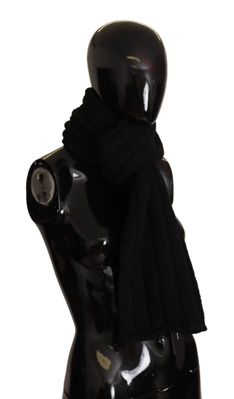 Black ribbed knit wool scarf draped on a black mannequin