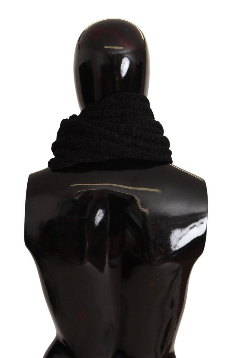Black virgin wool knitted scarf wrapped around a mannequin neck