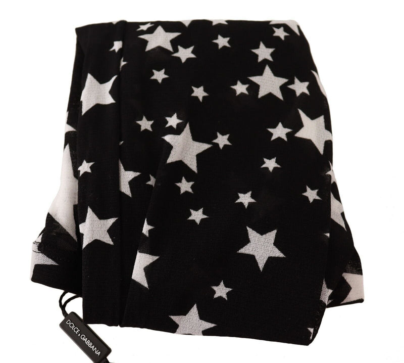 Black nylon stockings with a white star print folded with a Dolce and Gabbana tag visible