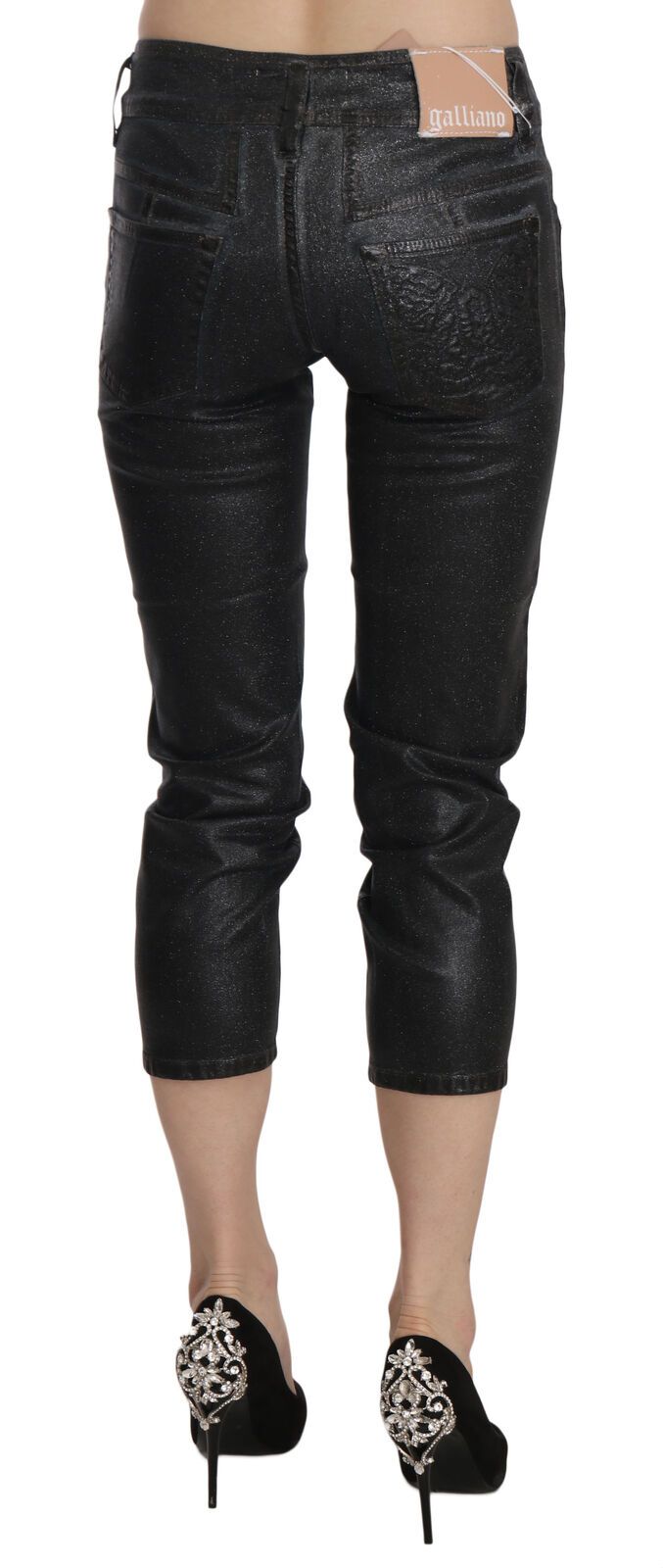 Black washed slim-leg cropped denim pants with mid-rise waist worn with black heels