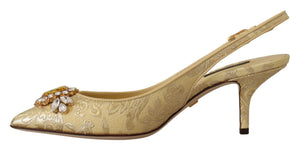 Dolce & Gabbana gold brocade slingback pumps with a pointed toe, kitten heel, and decorative crystal embellishment.