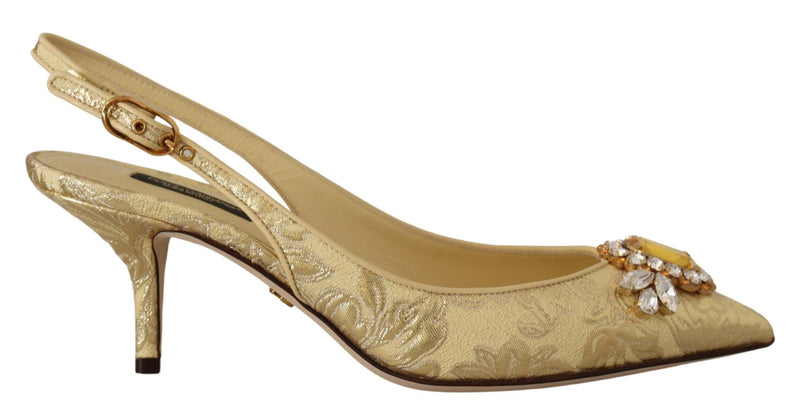 Gold brocade slingback pumps featuring a pointed toe with a large crystal and yellow gemstone embellishment.