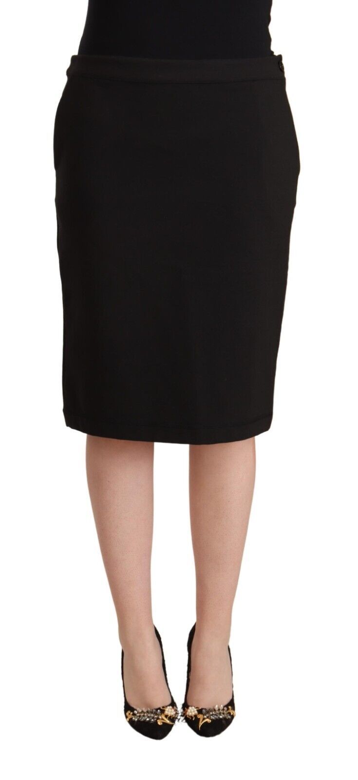 Black straight pencil cut knee-length skirt worn with black heels