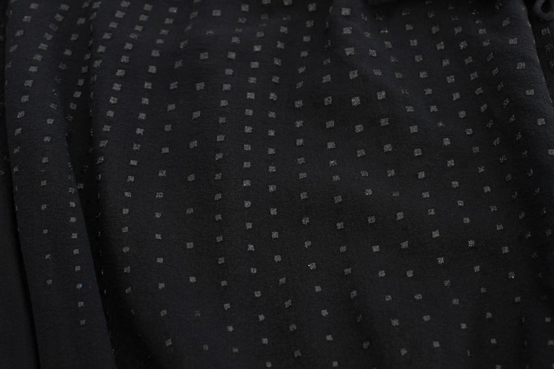 Black chiffon blouse with textured dot pattern