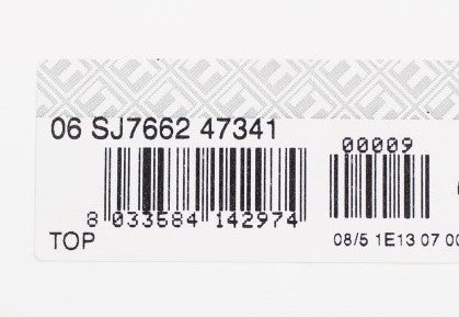 White product tag with black text and barcodes