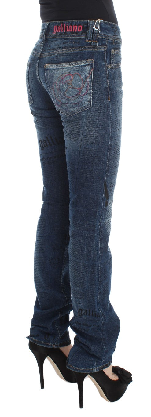 John Galliano blue wash cotton blend slim fit bootcut jeans with newspaper print and rose embroidered pocket