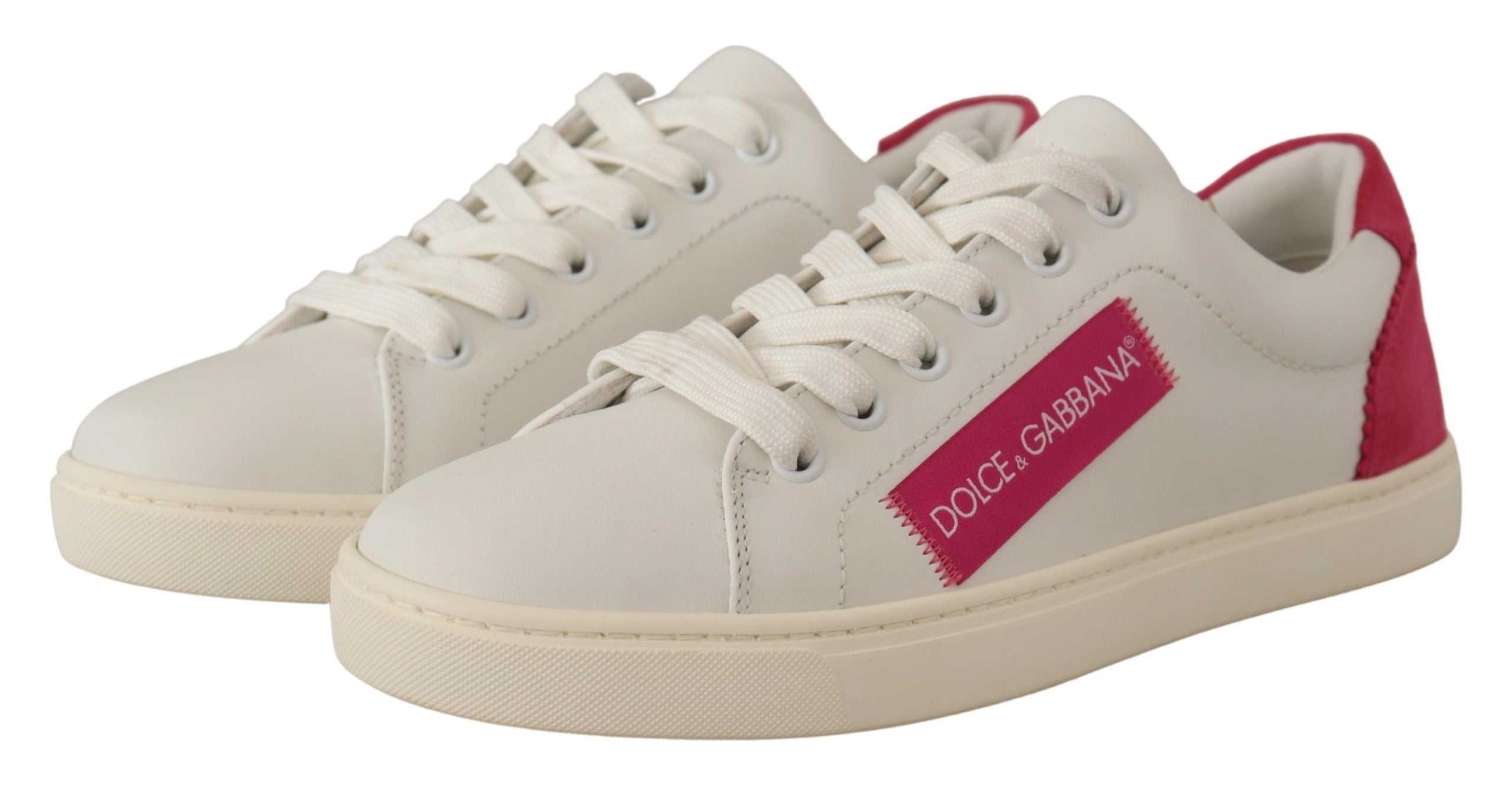Dolce & Gabbana white leather low-top sneakers with pink suede heel tab and pink logo patch on the side.