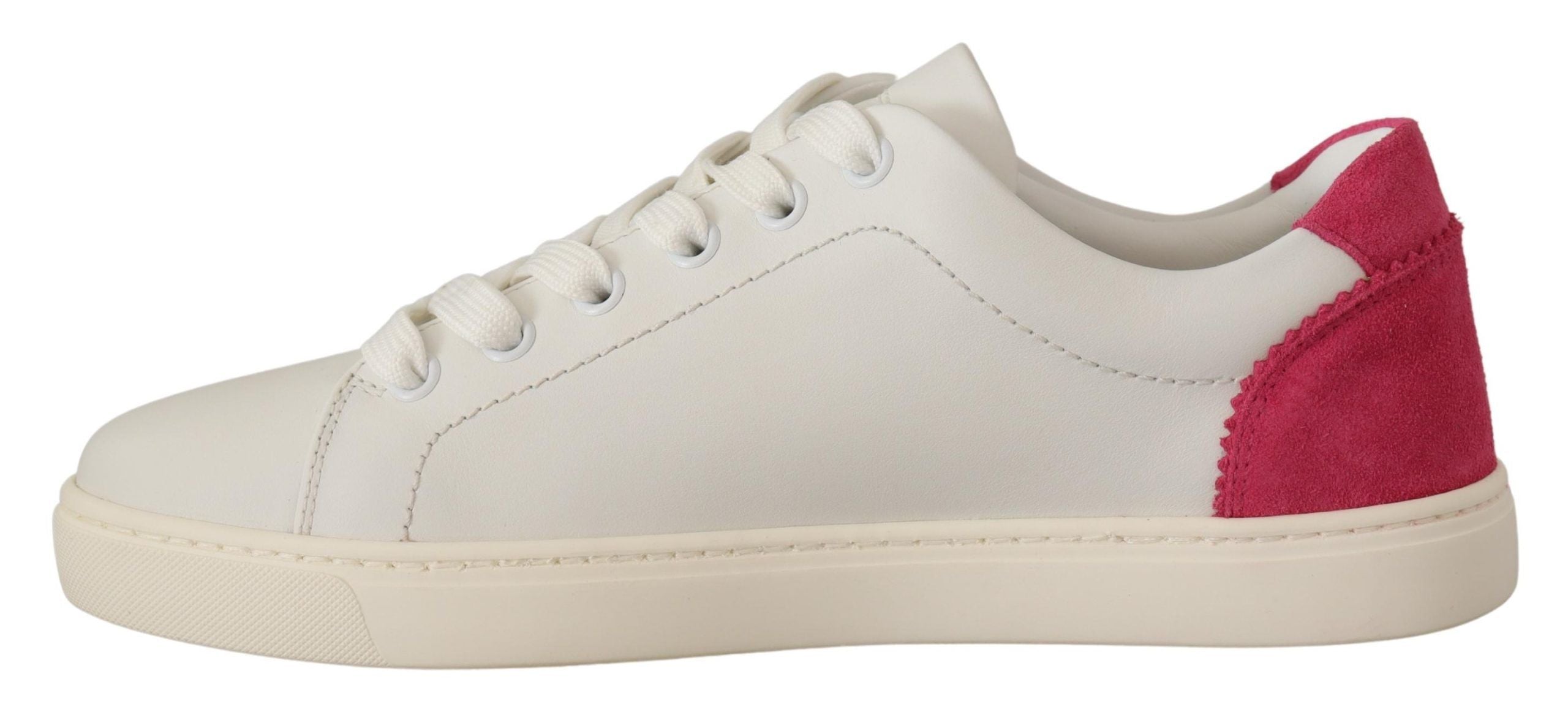 Dolce & Gabbana white leather low-top sneakers with a pink suede heel tab and white rubber sole.