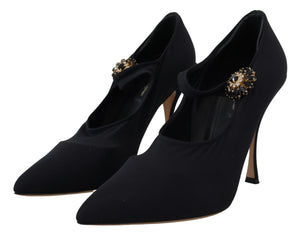Dolce & Gabbana black stretch fabric pumps with pointed toes, stiletto heels, and crystal-embellished Mary Jane straps.