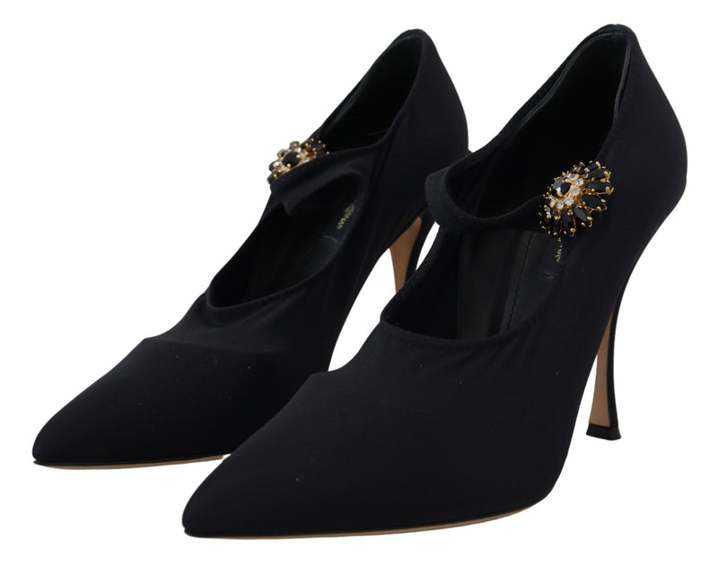 Dolce & Gabbana black stretch fabric pumps with pointed toes, stiletto heels, and crystal-embellished Mary Jane straps.