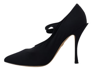 Black stretch fabric pointed-toe pump with a thin ankle strap and high stiletto heel by Dolce & Gabbana.