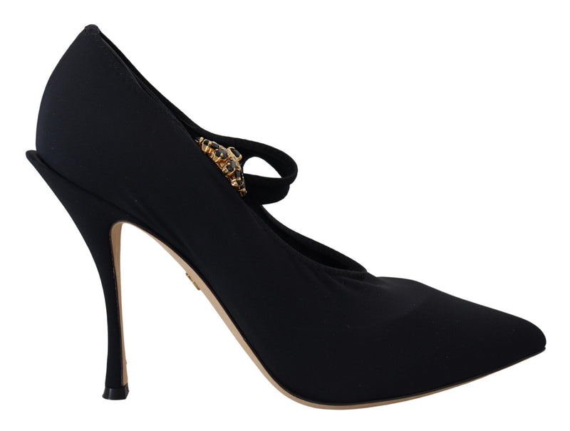 Black stretch fabric pointed-toe pump with a thin ankle strap and embellished gold crystal detail.