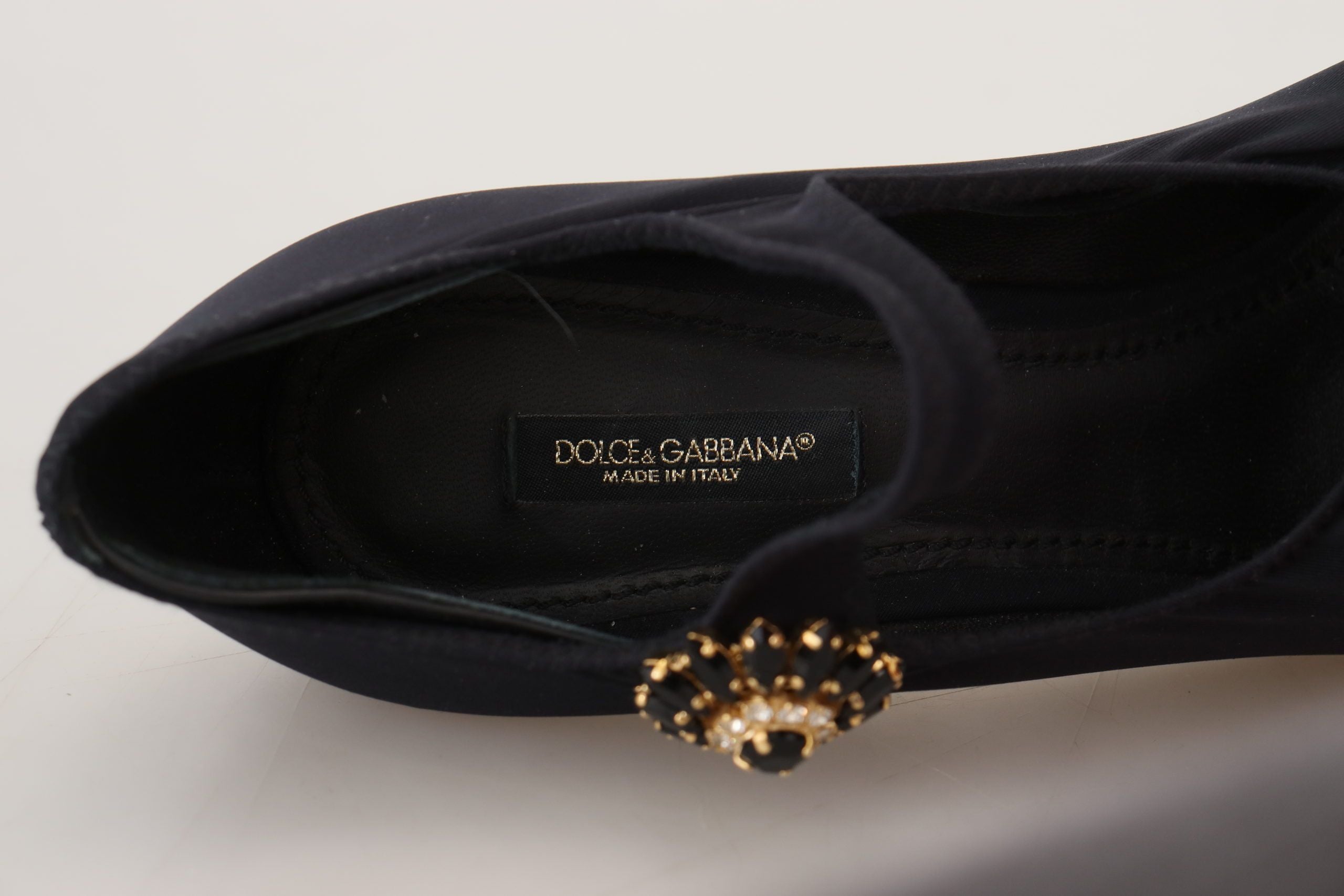 Black Dolce & Gabbana stretch sock pump with a jeweled crystal embellishment on the strap and branded inner label.