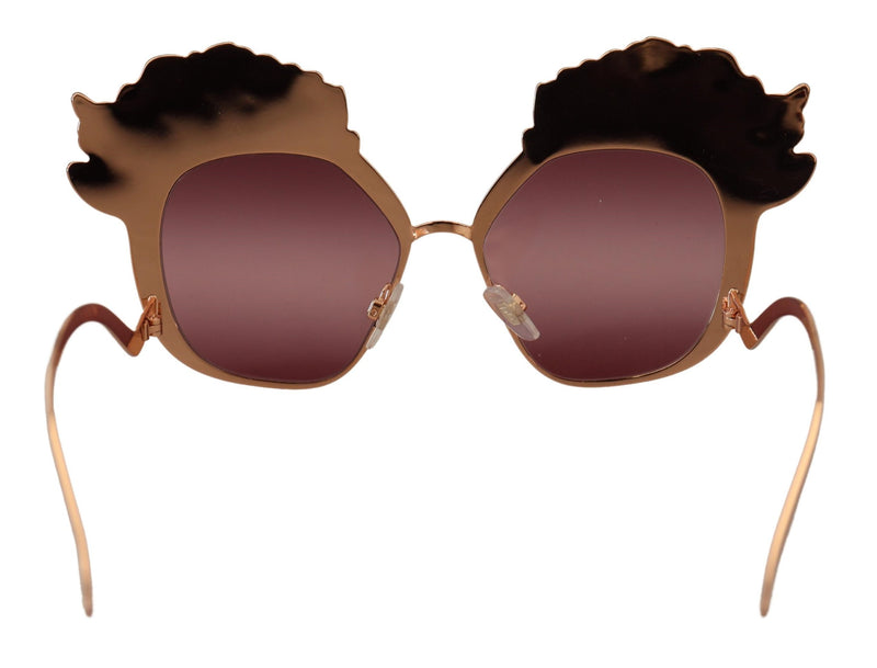 Pink gold sunglasses featuring metallic floral embellishments above tinted lenses and curved temples