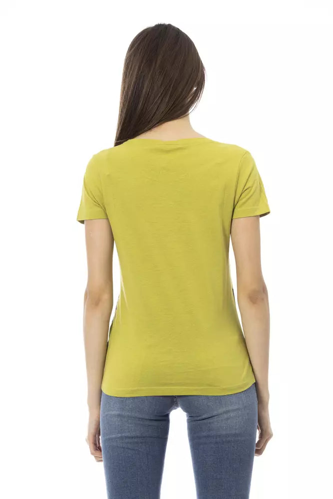 Back view of a woman wearing a plain green cotton t-shirt and blue jeans