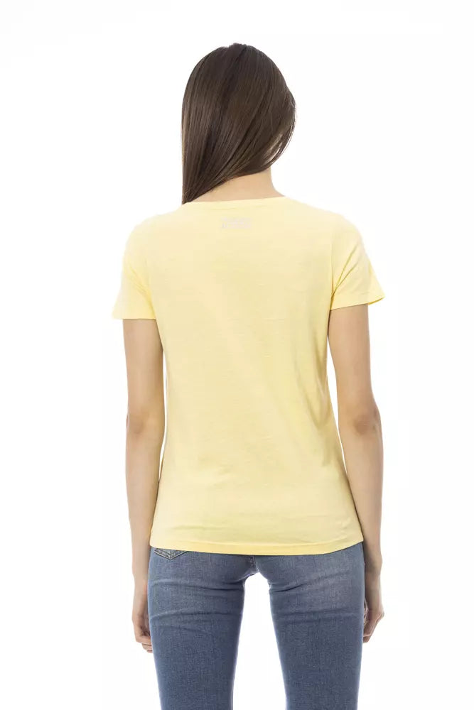 Back view of a woman wearing a plain yellow cotton t-shirt with short sleeves and blue jeans