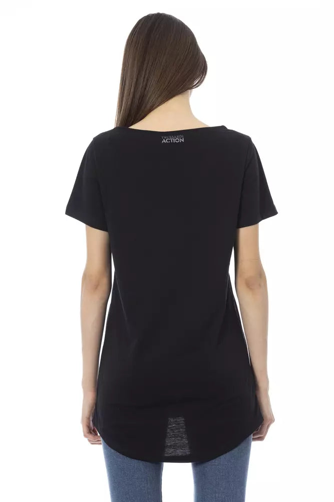 Back view of a woman wearing a black cotton t-shirt with short sleeves and a small brand logo on the upper back