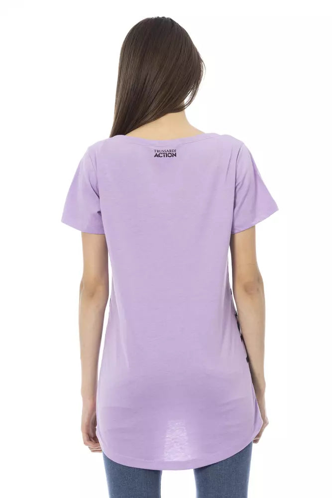 Back view of a woman wearing a purple cotton t-shirt with short sleeves and a small brand logo at the neckline