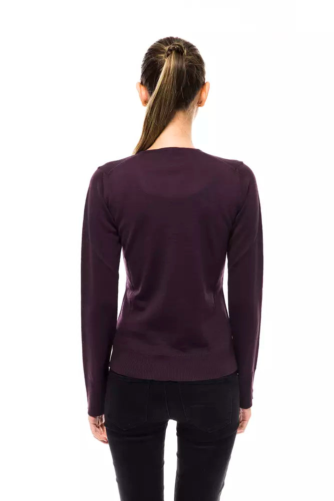 Back view of a woman wearing a dark purple wool long-sleeve sweater