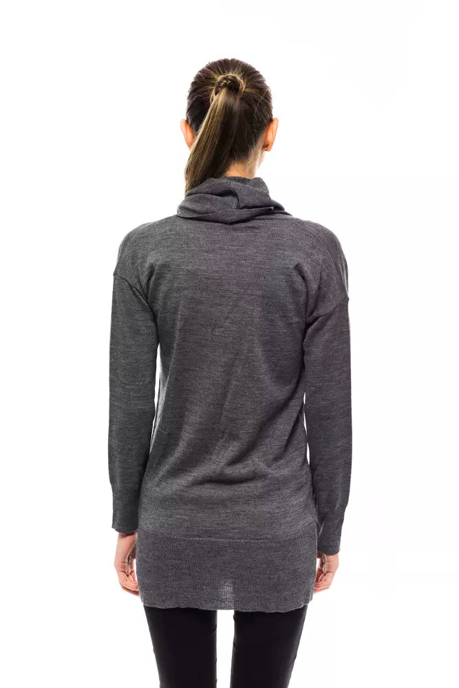 Back view of a woman wearing a blue-gray wool turtleneck sweater with long sleeves and ribbed hem