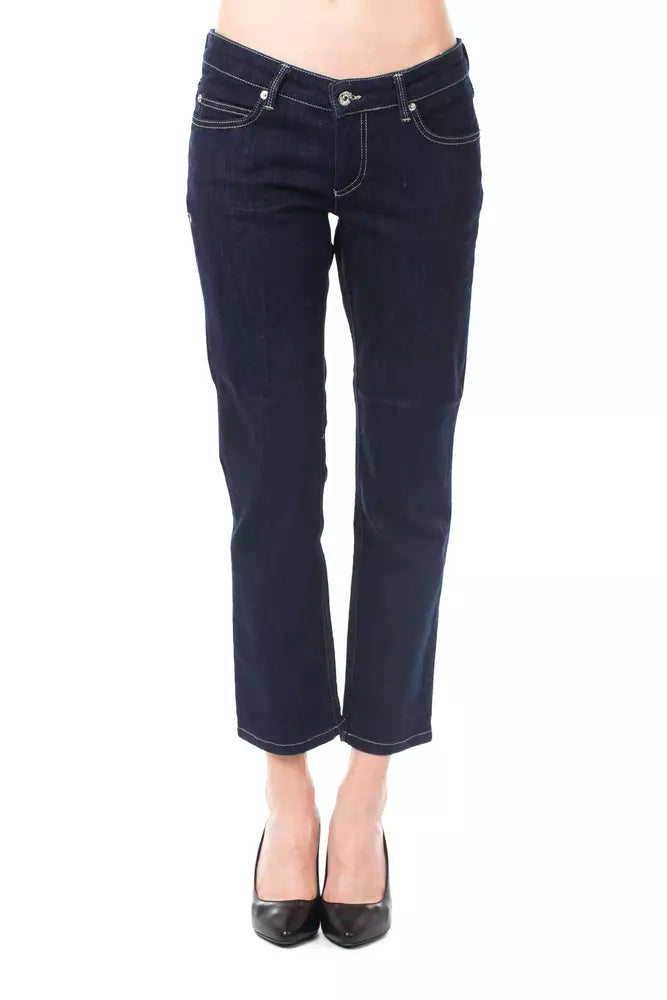 Dark blue cotton women capri jeans with white stitching worn with black heels