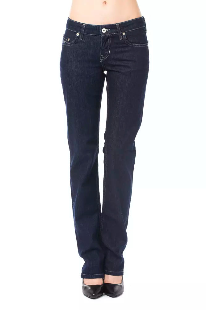 Dark blue cotton women's jeans in a slim straight leg style worn with black heels