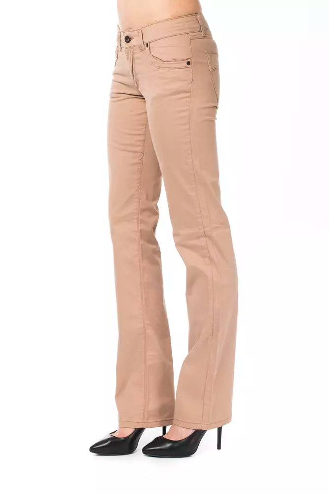 Beige cotton women's bootcut jeans worn with black heels