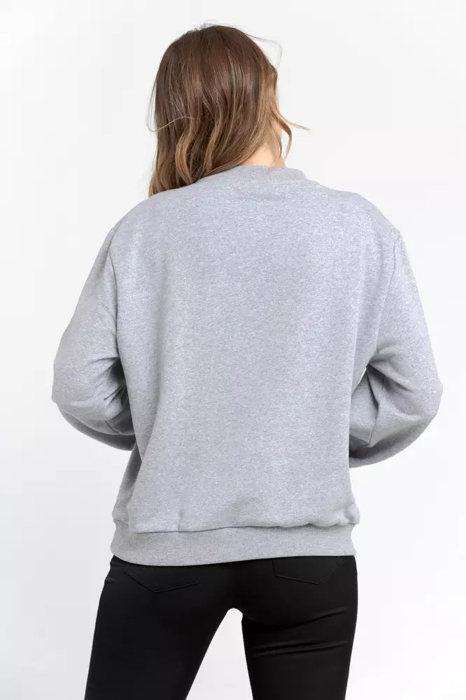 Woman wearing a grey cotton long sleeve crew neck sweatshirt from the back
