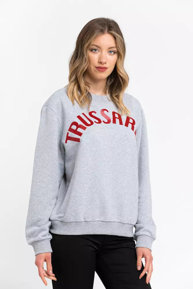 Woman wearing a grey cotton sweatshirt with red Trussardi lettering on the chest
