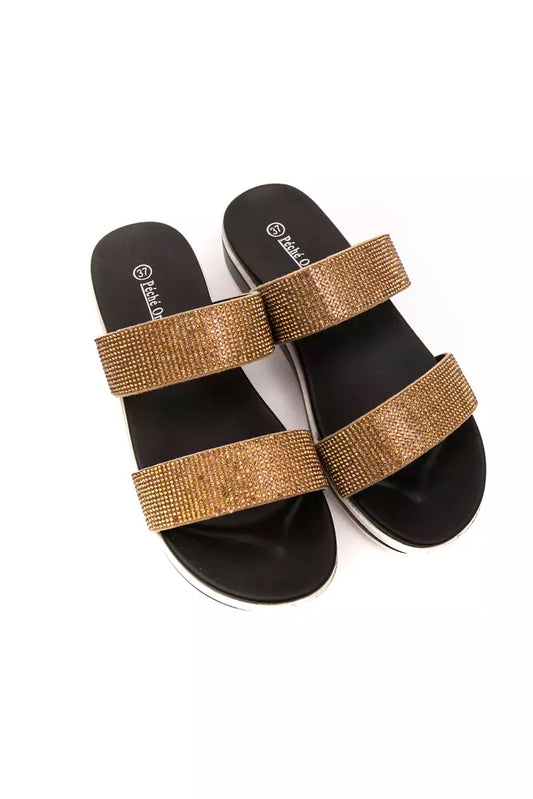 Péché Originel women's beige rhinestone-embellished double-strap slide sandals with black soles.