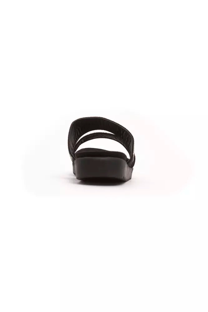 Péché Originel black textile slide sandal with two straps and a flat sole, viewed from the back.