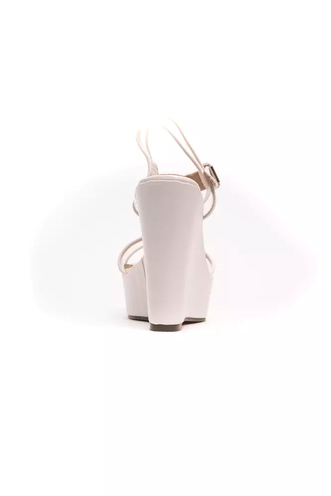 White polyethylene platform wedge sandal with slim ankle straps and a buckle closure, viewed from the back.