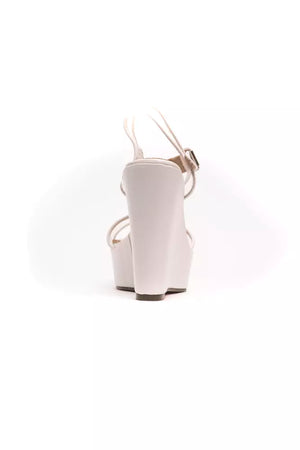 White polyethylene platform wedge sandal with slim ankle straps and a buckle closure, viewed from the back.