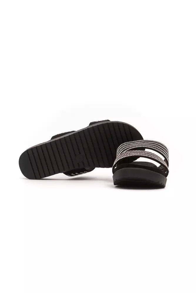 Péché Originel black textile slide sandals featuring dual crystal-embellished straps and a ridged black platform sole.