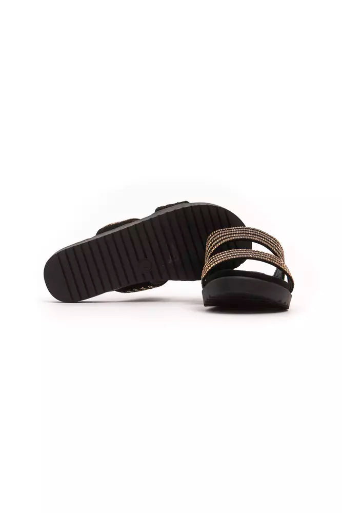 Péché Originel women’s black slip-on sandals with gold rhinestone-embellished double straps and ridged rubber soles.