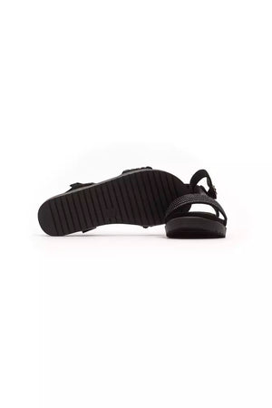 Péché Originel black textile slide sandals featuring a thick, ridged sole and a crystal-embellished strap.