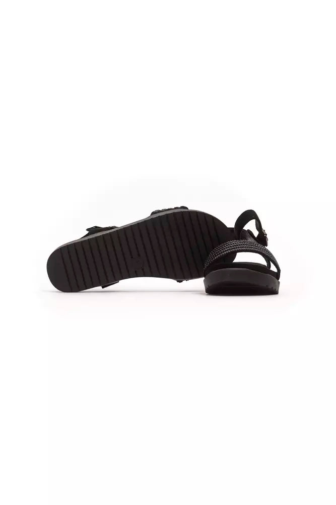 Péché Originel black textile slide sandals featuring a thick, ridged sole and a crystal-embellished strap.