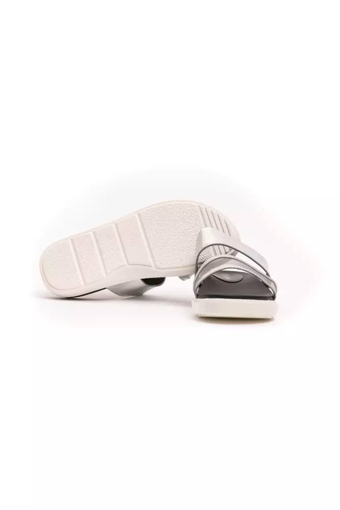 Péché Originel silver polyethylene slide sandals featuring thin metallic straps and a white textured sole.