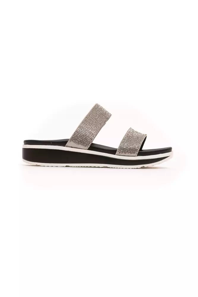 Péché Originel silver rhinestone-embellished double-strap slide sandal on a black and white platform sole.