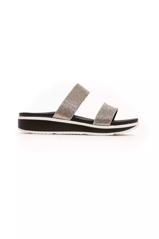 Péché Originel silver rhinestone-embellished double-strap slide sandal on a black and white platform sole.