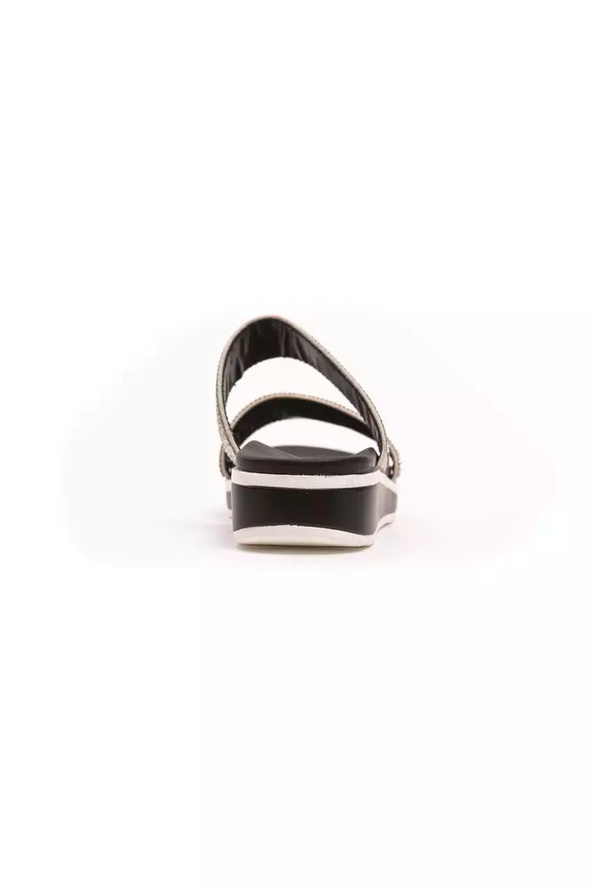 Péché Originel silver textile slide sandal with a black platform sole, viewed from the back.