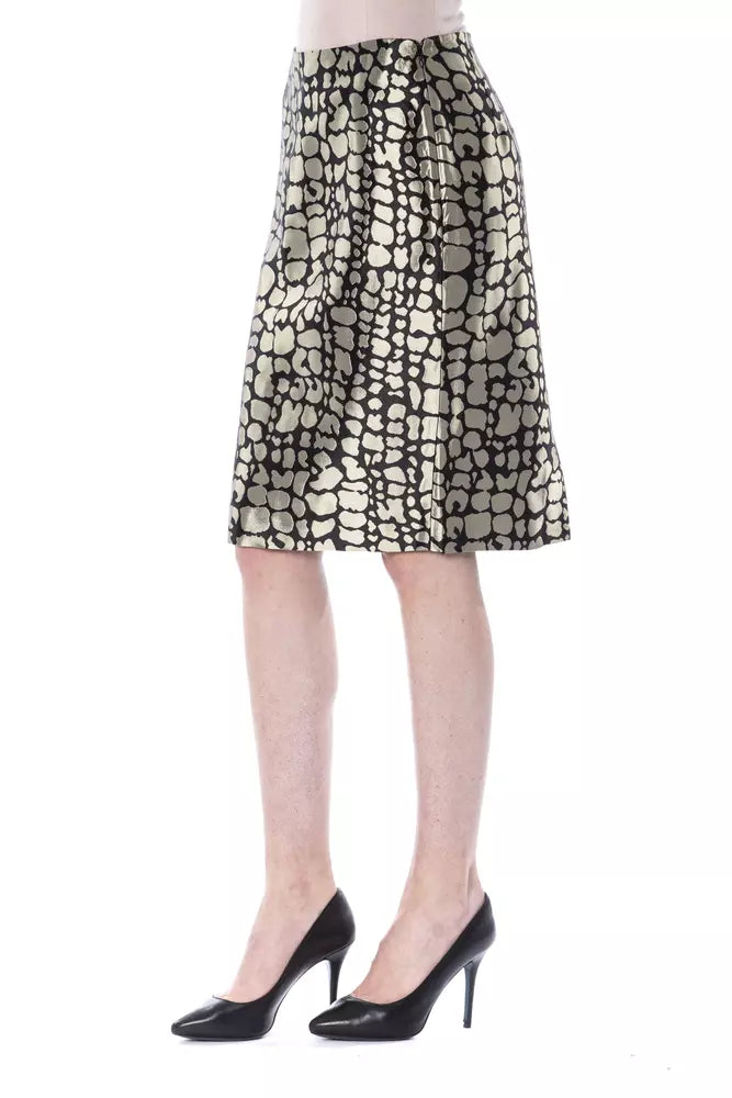 Gold and black patterned knee-length viscose skirt on a model wearing black high heels