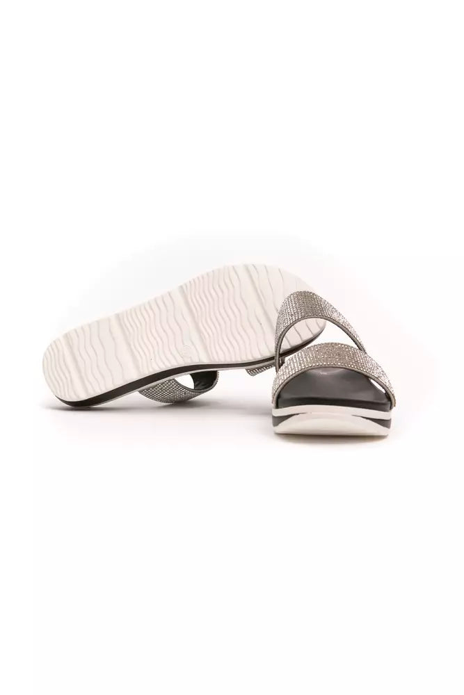 Silver textile slide sandals for women with dual embellished straps and a white, textured platform sole.