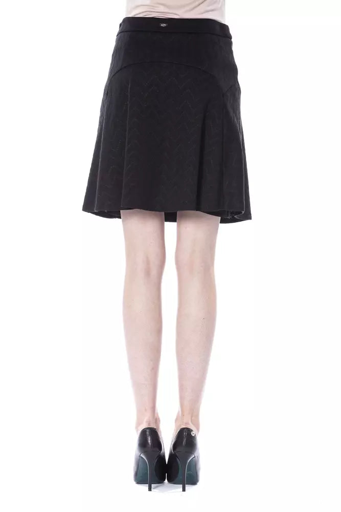 Black polyester women skirt with subtle pattern, flared style, worn by a model from behind