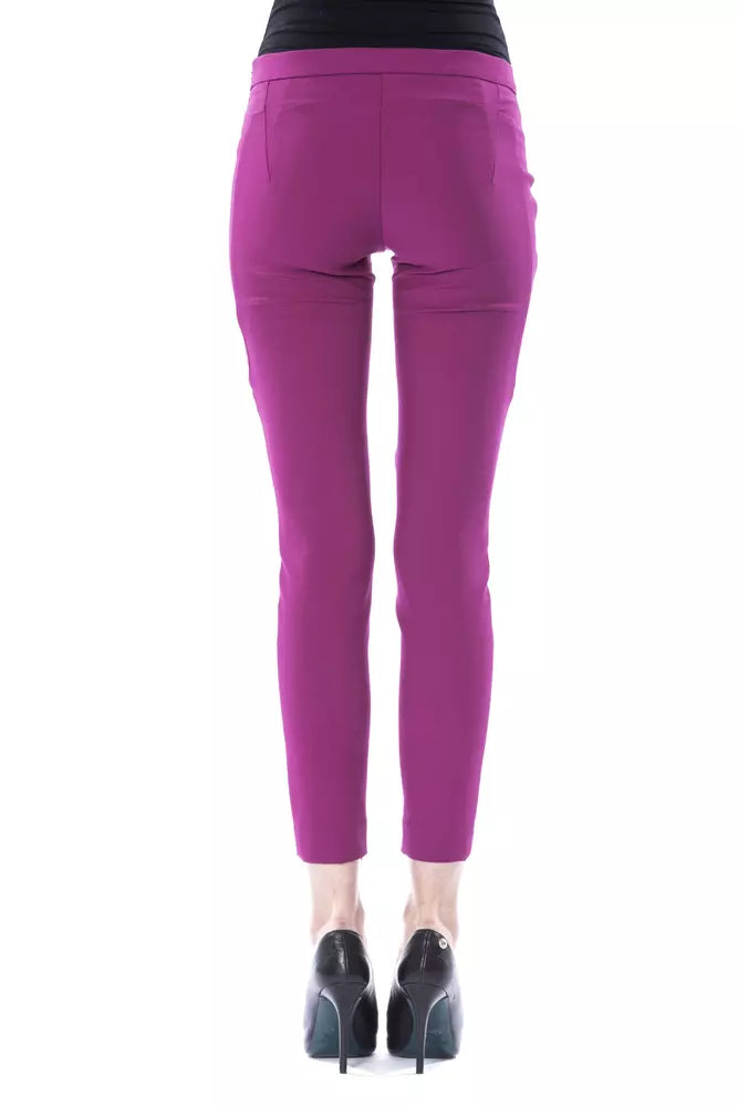 Back view of BYBLOS purple polyester ankle-length skinny women pants paired with black high heels