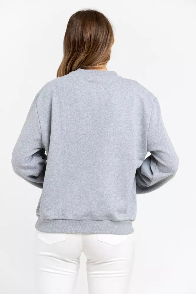 Back view of a woman wearing a gray cotton crewneck sweatshirt with ribbed cuffs and hem