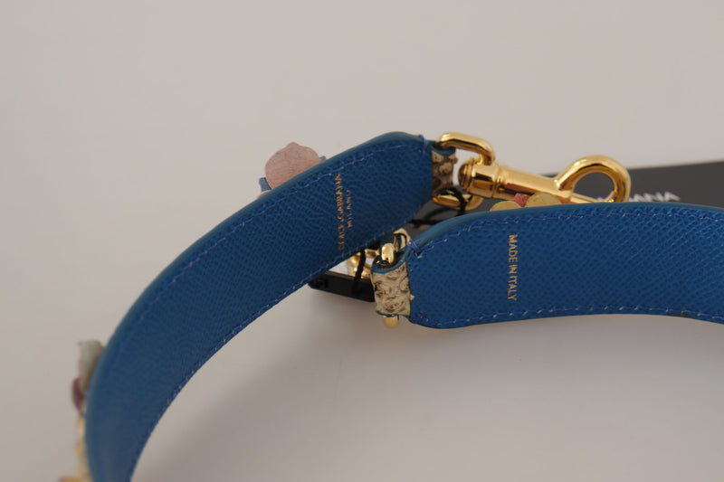 Blue leather shoulder strap with gold hardware and floral studs